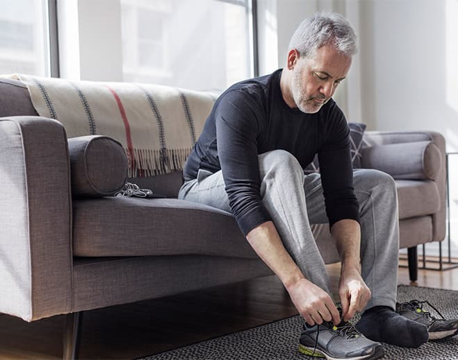 Man tying sneakers